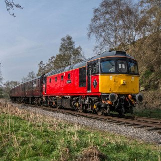 "Eastleigh" in her splendid red paint rides towards Consall with the early morning trip to Froghall