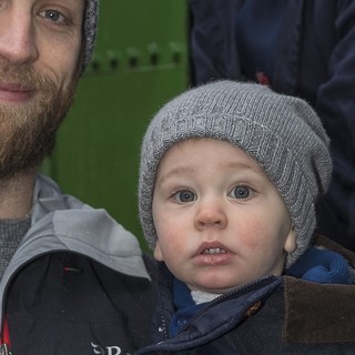 Volunteer Fireman takes a break and talks to a couple of excited passengers