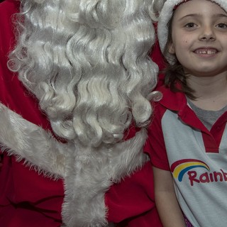 Santa takes a moment to pose with a few of the Brownie Girls attending on the first weekend!